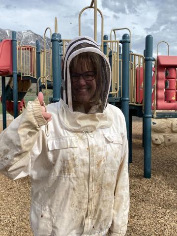 Mrs. Huntsman suits up to help with the Bees